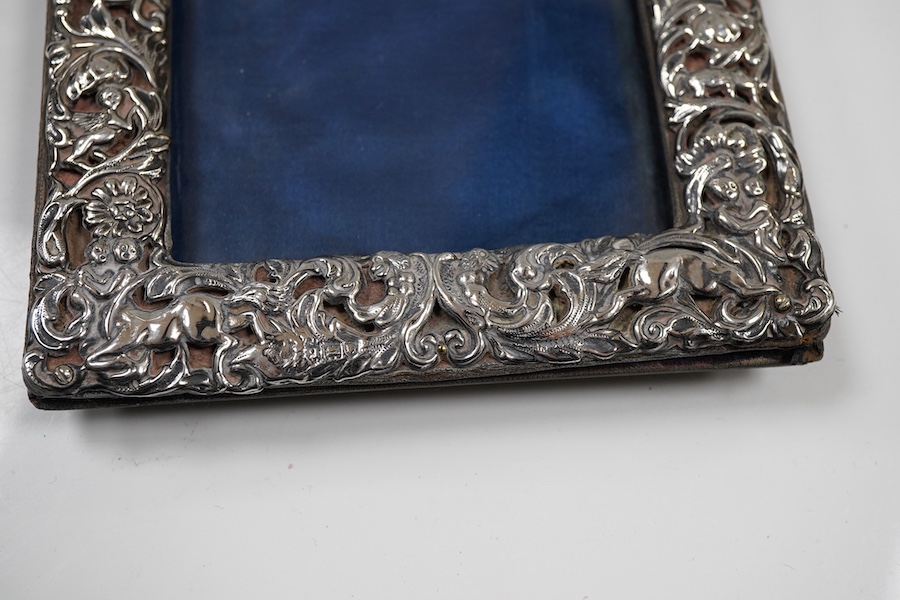 A George V repousse silver mounted rectangular photograph frame, maker's mark rubbed, London, 1911, 18.3cm.